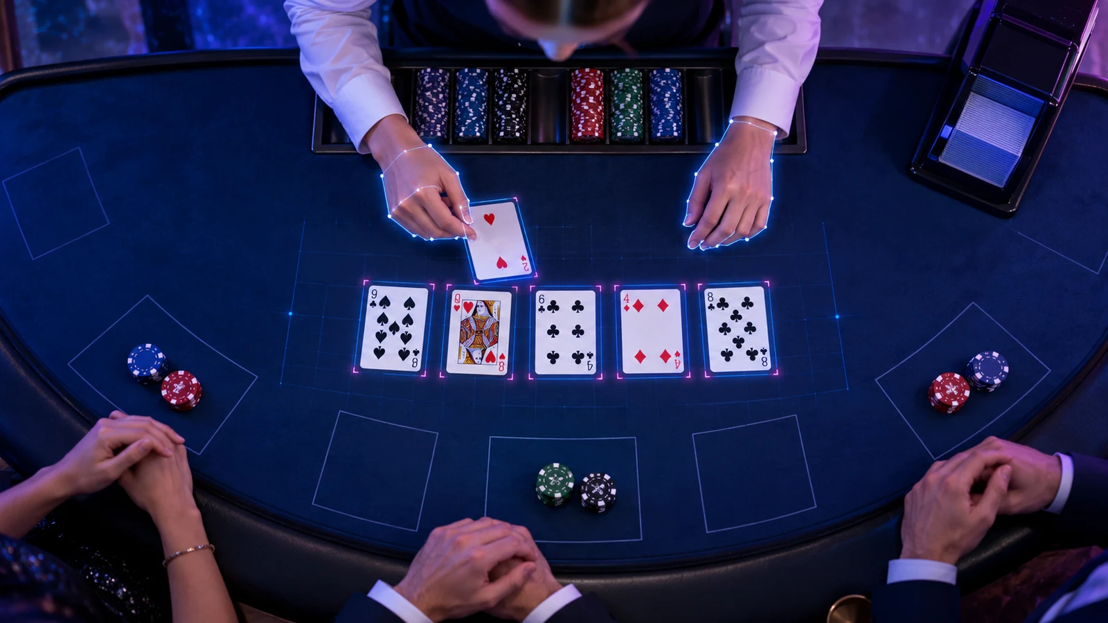 A vision system outlines cards and hands on a live table.