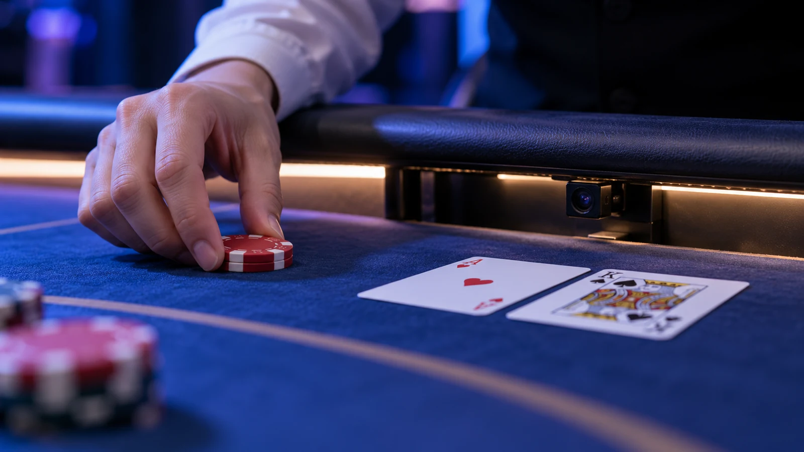 A close camera captures cards and chip placement on a table.