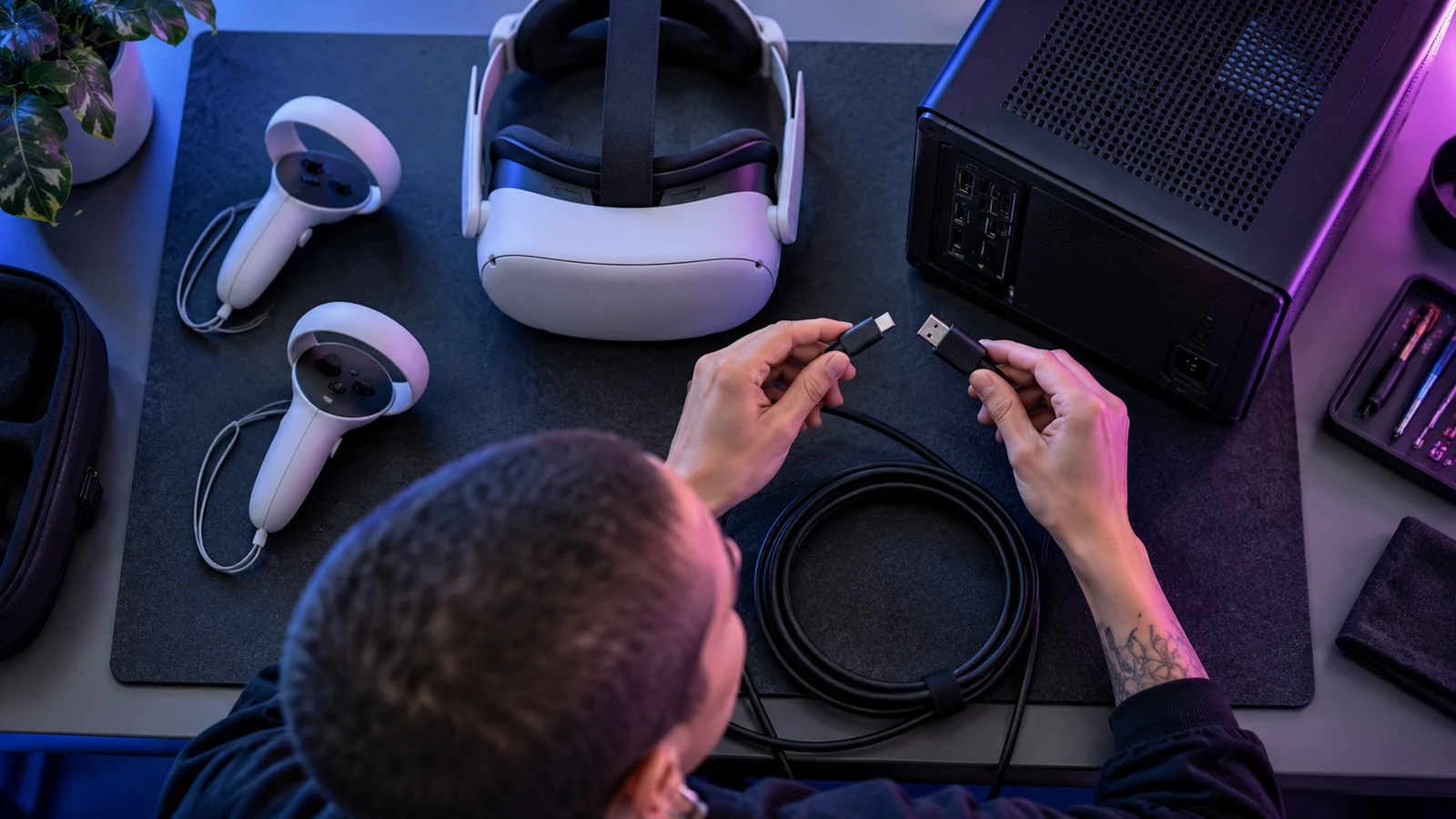 A technician compares headset hardware and connection options.
